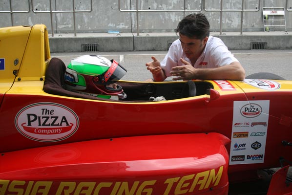 Sandy at pit stop getting instructions from coach Philippe Descombes