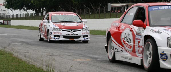 Sandy chasing his mentor Thomas in his 550 BHP SuperCar at Bira, May 2009.